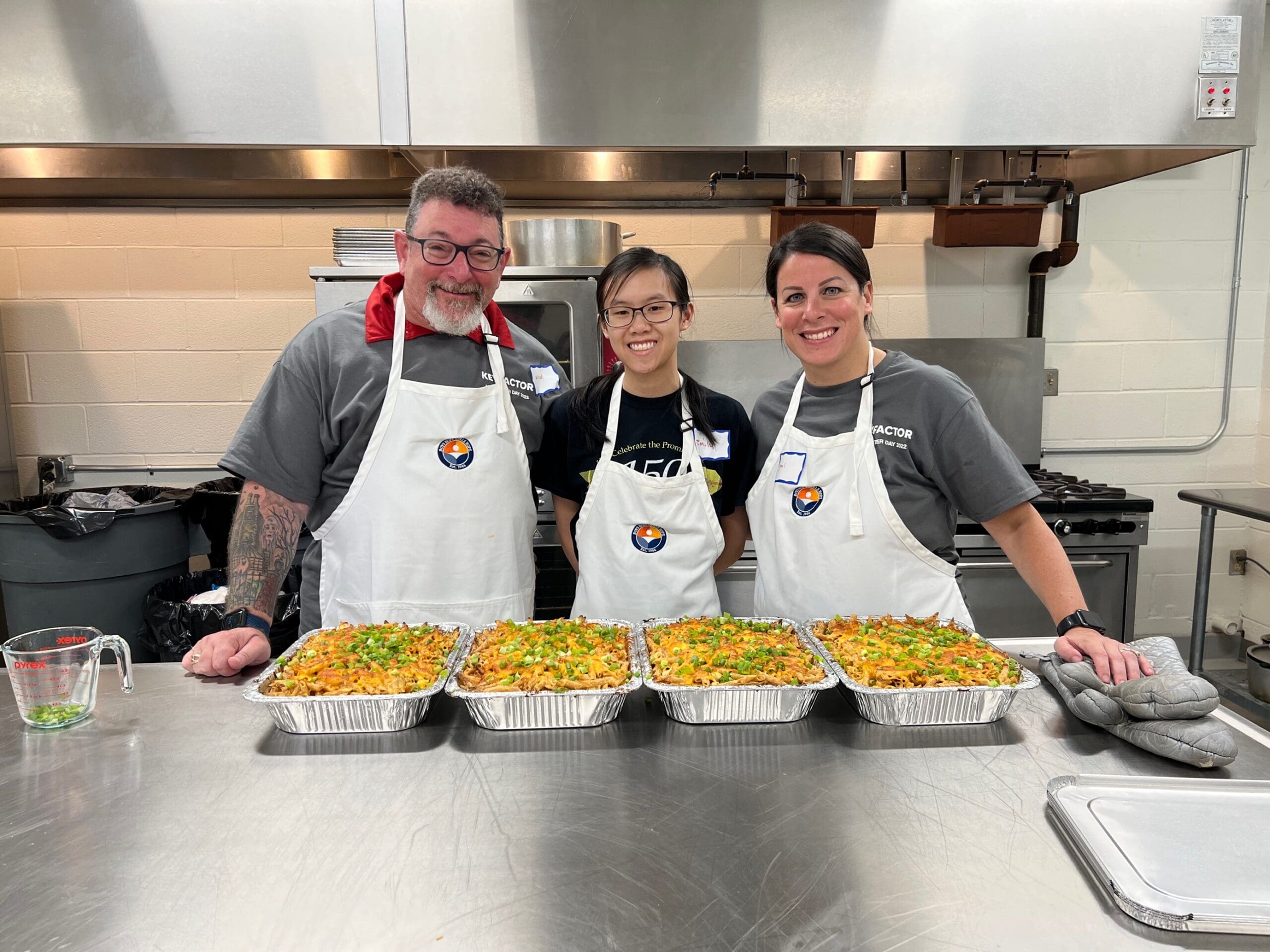 Keyfactor team members preparing food during Volunteer Days 2022