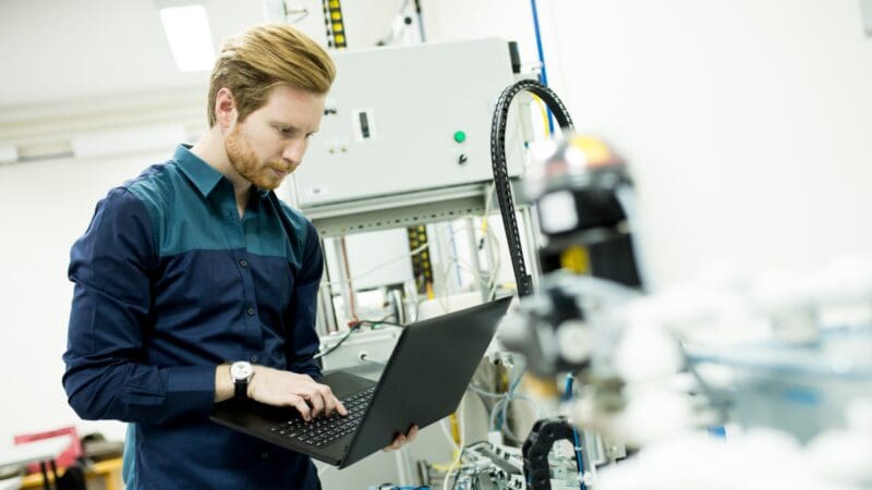 photo of man using laptop