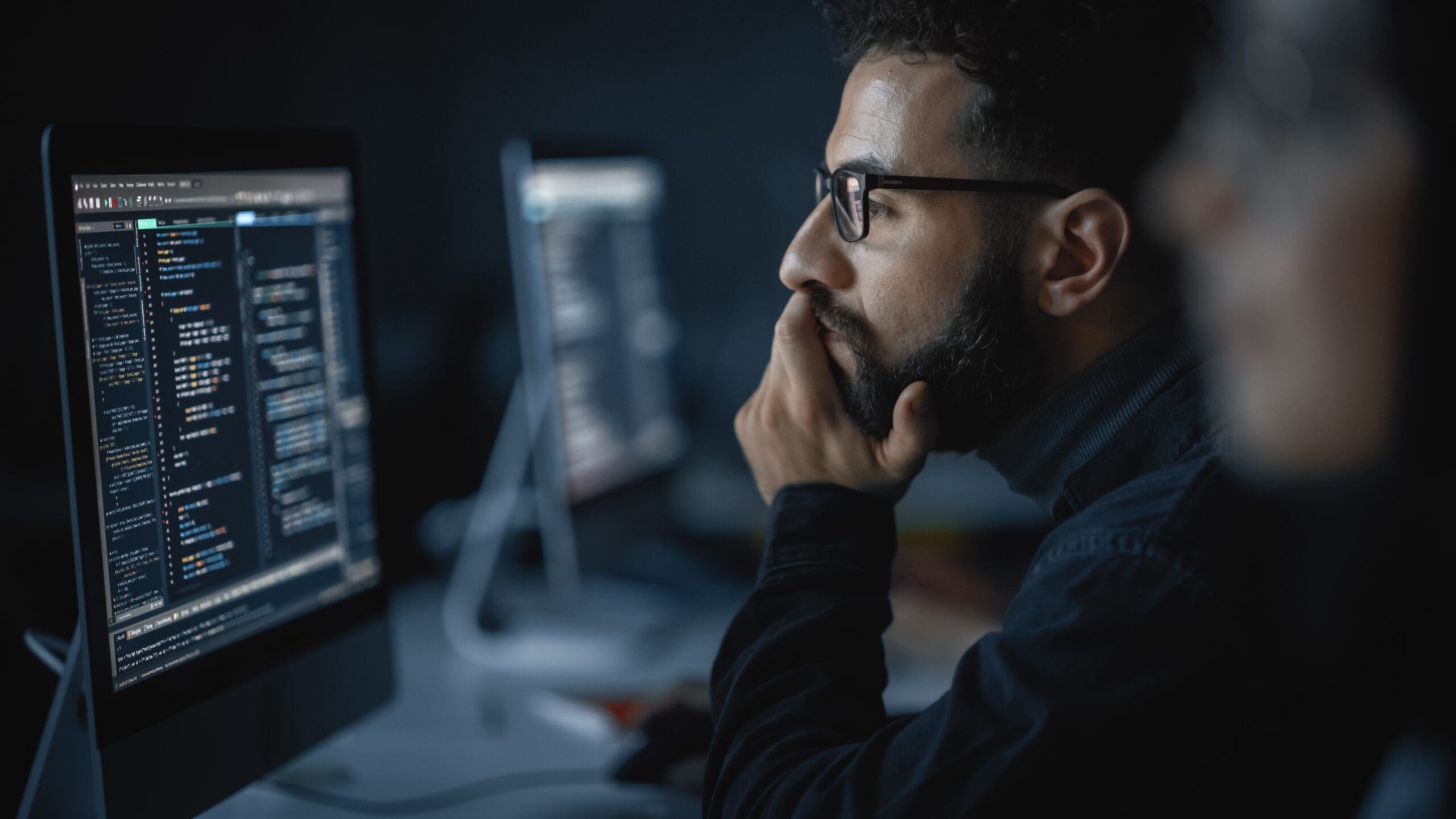 Handsome,Smart,Male,Student,,Studying,In,University,With,Diverse,Multiethnic profile photo of man looking at computer screen