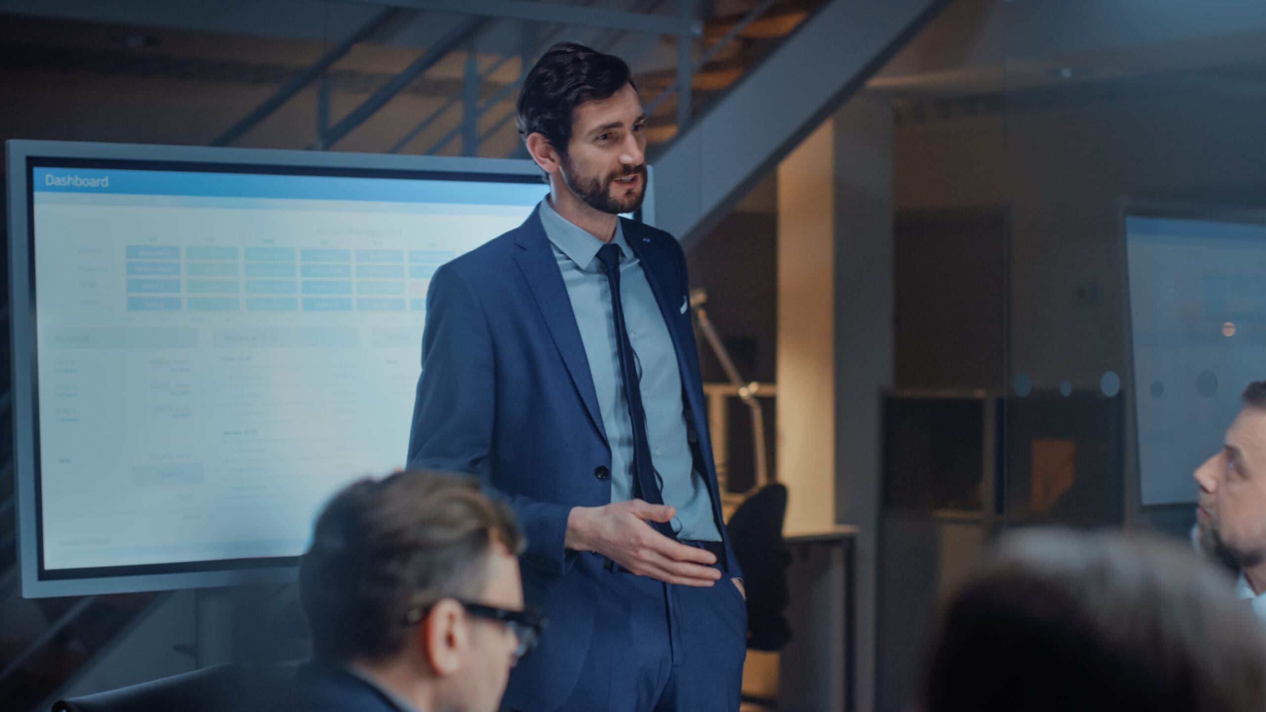 photo of man giving a presentation to a group