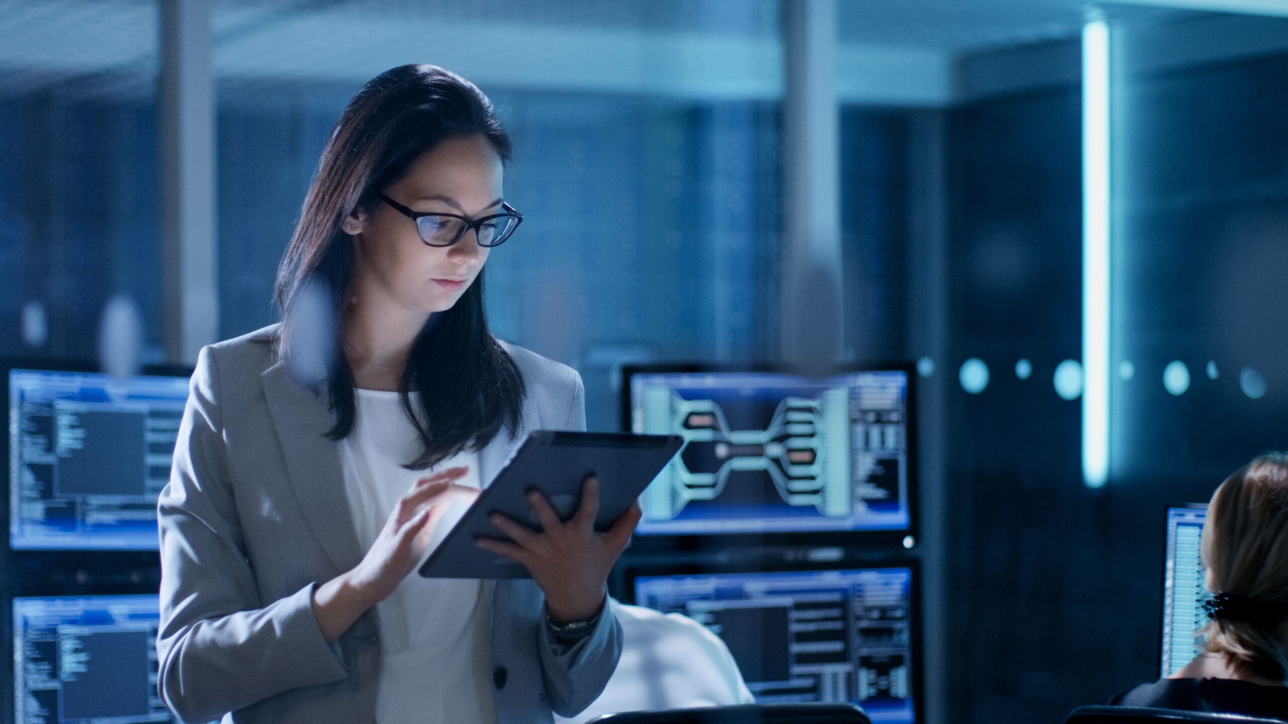 photo of woman working on a tablet