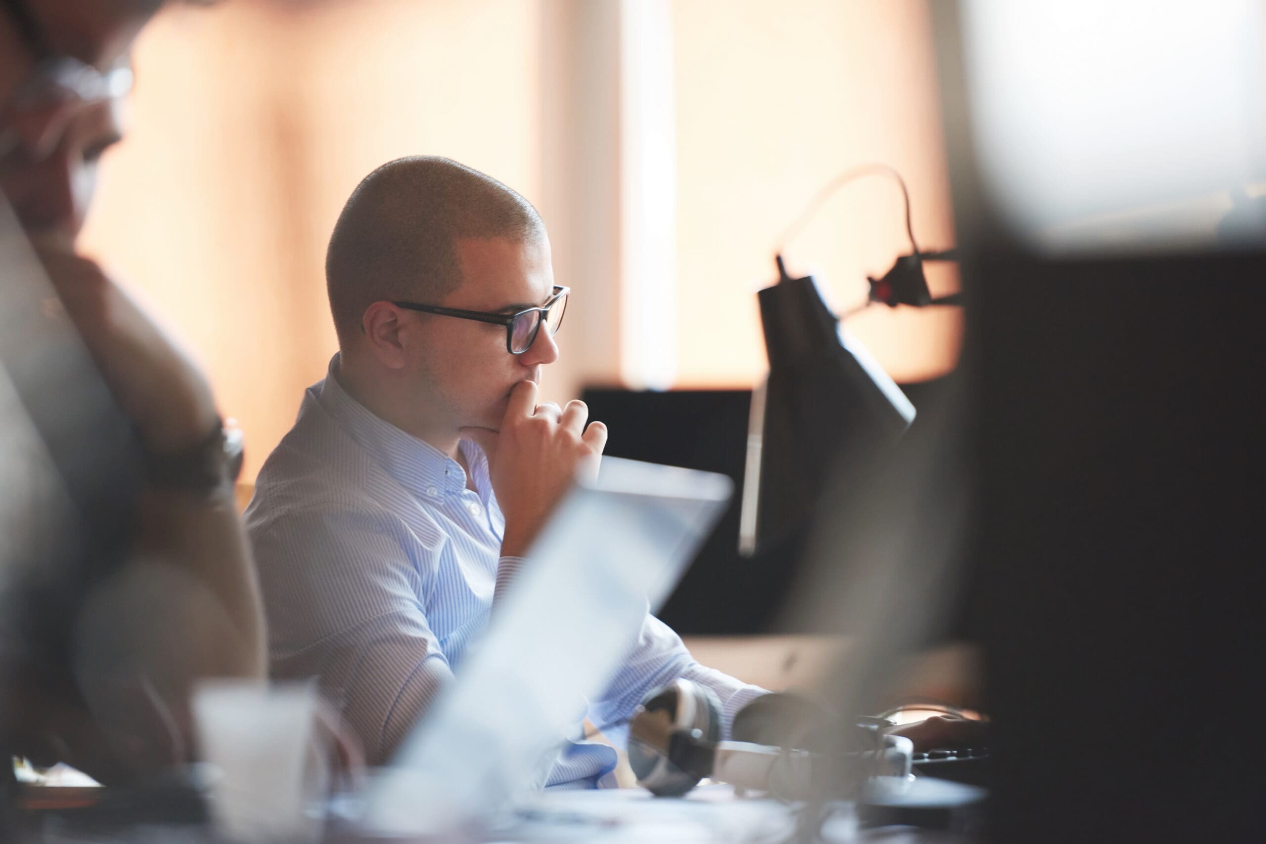 profile image of man looking thoughtfully at a computer