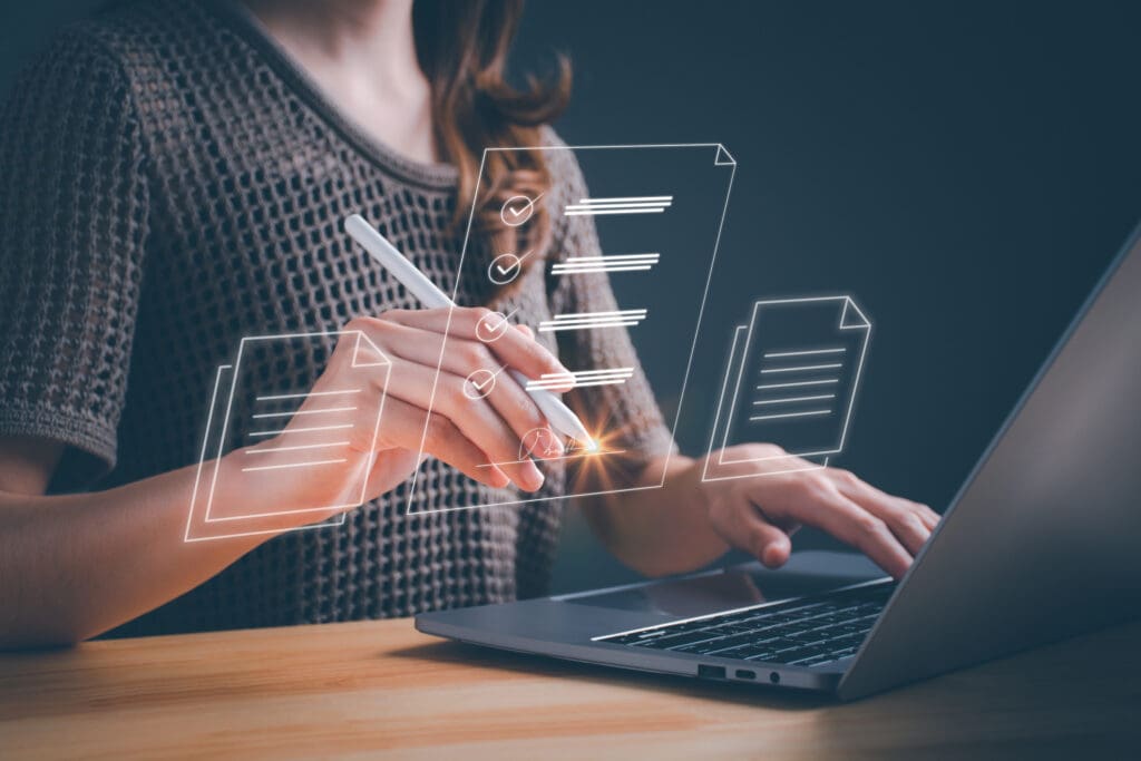 Worker looking at a laptop, learning that automation can prevent expired certificates from compromising a website's security and reputation.