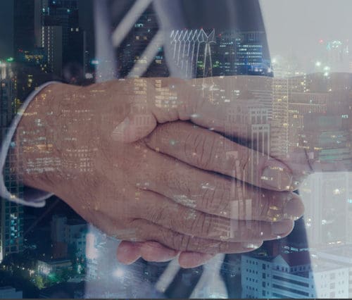 photo of handshake and city at night