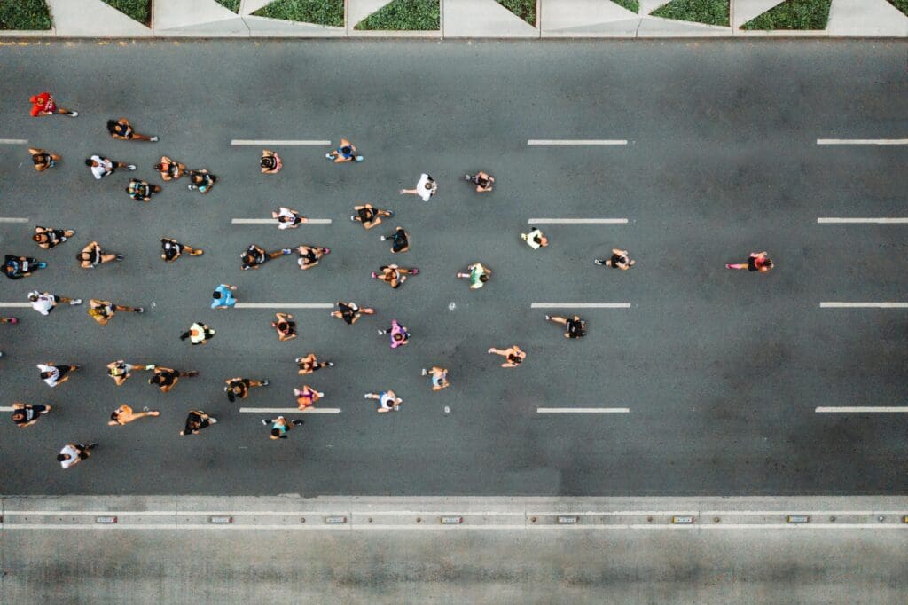 overhead photo of a group of runners on a street without cars
