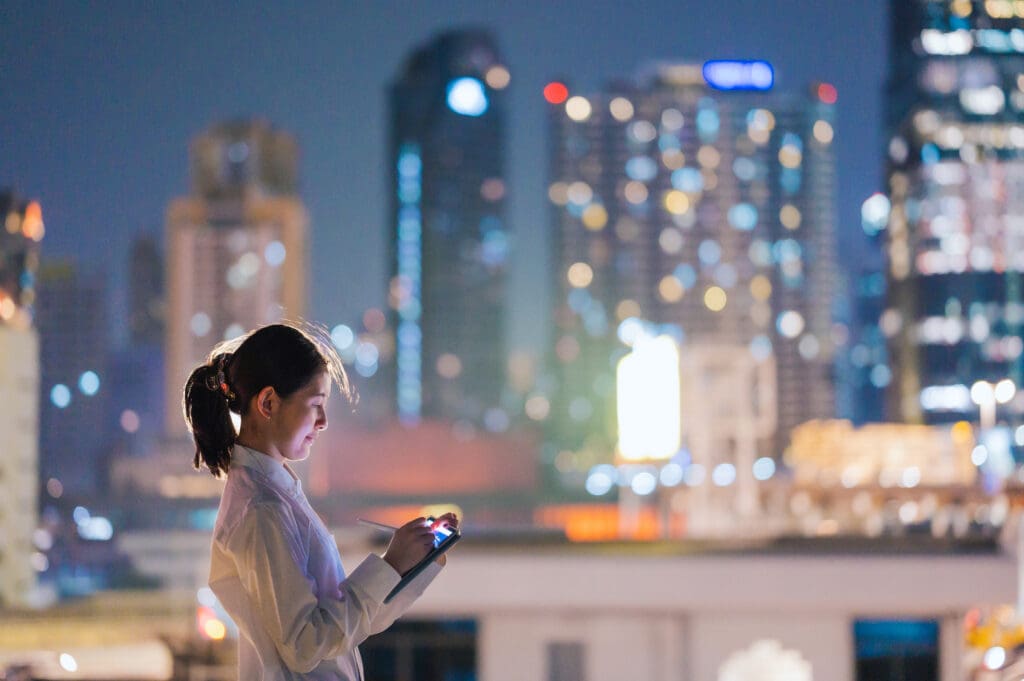 A company engineer trying to manage PKI across the organization, with cityscape behind her.