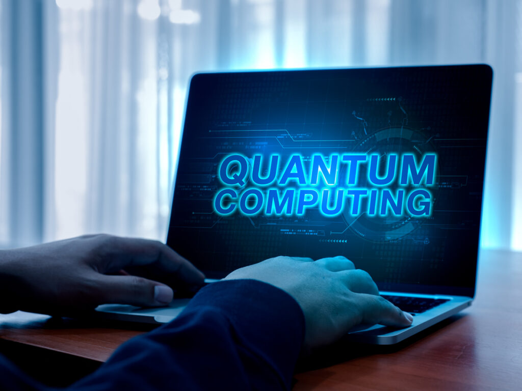 Quantum Computing, Future Technology Concept. Glowing Text Quantum Computing With Abstract Hand Working.