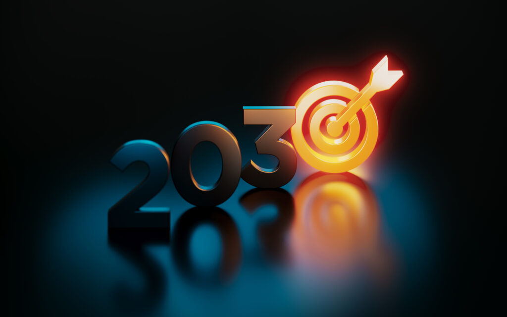 Orange target symbol glowing next to 2030 on black background. Horizontal composition with copy space. Sustainable development goals concept.