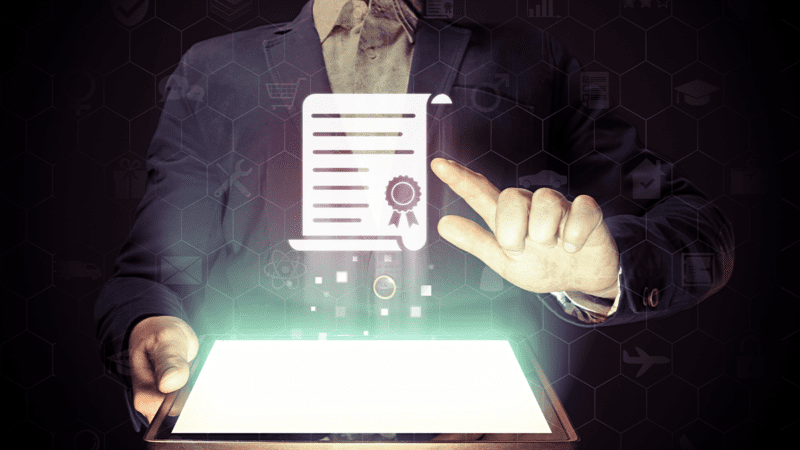 photo of man pointing at digital certificate